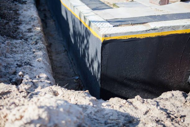 Professional Waterproofing technician working in North Judson, IN